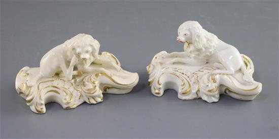 A pair of Derby porcelain figures of recumbent poodles, c.1825-45, L. 10.5cm, one restored